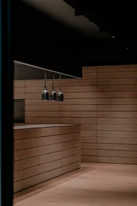 Modern commercial interior with wooden elements, featuring minimalist design.