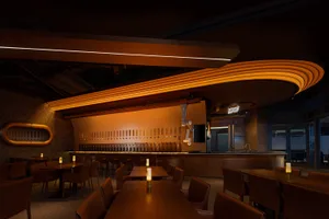 Industrial-themed restaurant interior with wooden bar counter and seating arrangement.