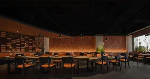 Modern restaurant interior with wooden walls and tables