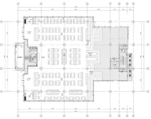 Floor plan of an industrial-style restaurant with tables and chairs arranged in a spacious and open layout.