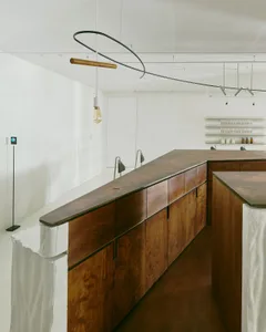 Modern commercial interior with wooden counter and minimalist design