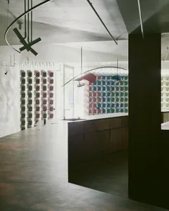 Modern cafeteria interior with concrete walls and floor.