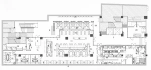 Interior design of a commercial space with multiple functional zones and furniture arrangements.