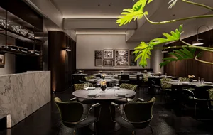 A modern indoor restaurant with marble, wooden, and glass elements.