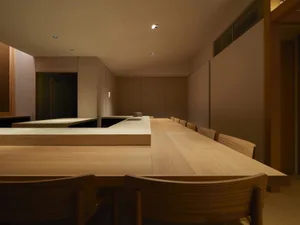 Modern restaurant interior with wooden tables and chairs