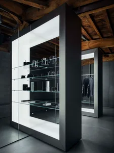 Modern retail store interior featuring glass shelves with minimalist products.