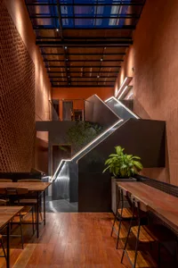 Interior of a modern coffee shop featuring decorative wood tiles.