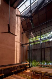 Modern coffee shop with industrial design elements and an emphasis on acoustic qualities.