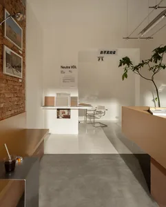 A minimalist, concrete-floored presentation hall