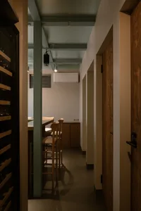 Modern dining area featuring wooden furniture, minimalist design, and sleek aesthetics.
