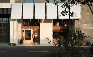 Modern commercial interior with concrete walls and glass windows.