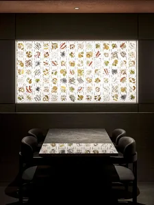 Modern restaurant interior featuring a glass cube with botanical illustrations