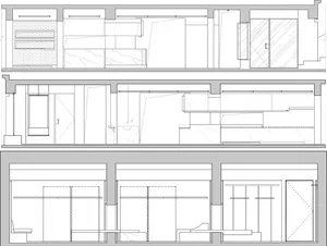 A detailed architectural floor plan of an interior space, featuring lines, crosses, and annotations on paper.