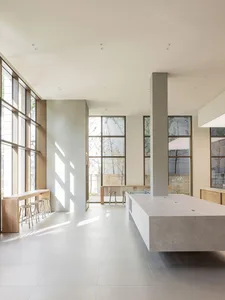 An image of a modern commercial space featuring a combination of concrete and glass materials.