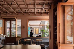 Modern restaurant interior featuring wooden elements and seating