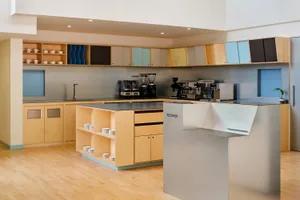 A modern kitchen with wooden cabinets and stainless steel appliances