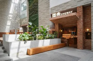 Modern restaurant interior with brick wall and glass wall