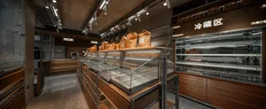 Modern bakery shop interior featuring wooden materials and design elements.