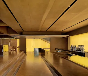 Minimalist interior design featuring modern kitchen with concrete and glass materials.