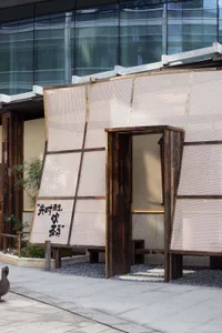 Modern storefront with wooden walls and glass facade