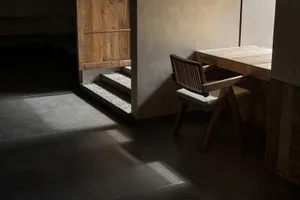 A modern commercial interior featuring wooden furniture and minimalist design.