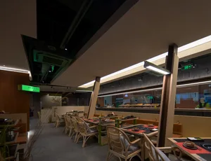 Modern industrial restaurant interior with concrete and glass materials.