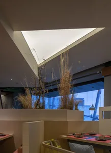 Contemporary interior design featuring wooden elements in a restaurant setting.