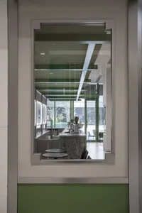 A modern coffee shop interior featuring a glass counter and sleek design elements.