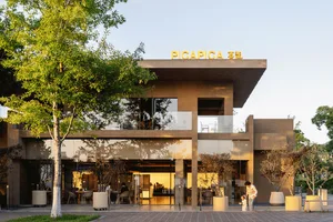 A modern commercial building with glass façade and minimalist design.