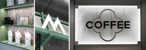 A coffee shop interior featuring a light-up panel sign with the word 'coffee'.