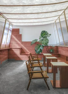 A minimalist workspace featuring a circular roof, glass windows, and wooden and concrete elements.