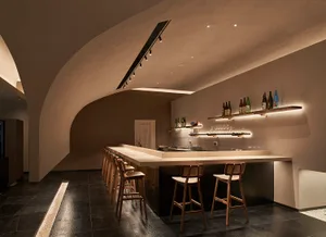 A modern industrial bar area with metal and wood elements.