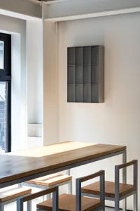 Industrial-style interior with wooden tables and metal chairs, minimalist design, modern space