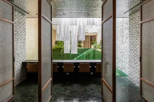 Contemporary restaurant interior with tiled flooring and exposed brick walls