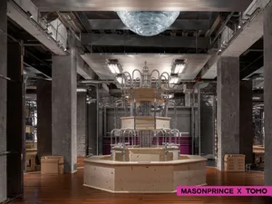 Modern industrial retail storefront with concrete elements and metal accents