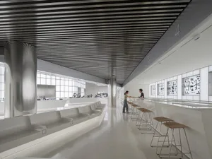 Modern interior design featuring concrete, metal, and glass materials.