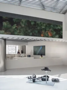 A modern office space with minimalist interior design, white walls, and a sleek, open layout.