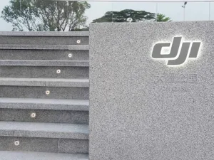 Granite staircase with illuminated signage and lighting.