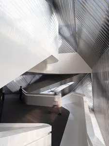 Modern, metallic staircase with minimalist design elements.
