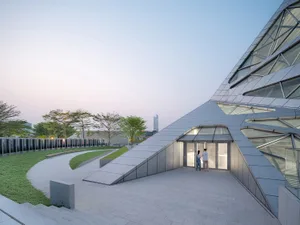 An exterior view of a modern building featuring a concrete platform.