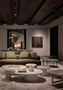 Industrial design living room featuring modern metal, glass, and wood elements.