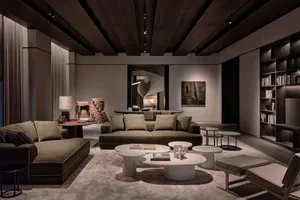 A spacious modern living room featuring two plush green sofas and several white round coffee tables.