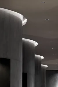 A modern interior design featuring concrete columns