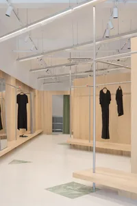 A modern retail store interior featuring wood elements.
