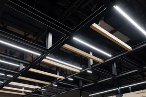 Modern industrial ceiling with steel and wood beams.