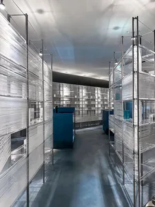 A modern industrial design interior with metallic shelving units.