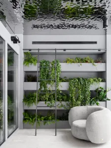 A modern residential interior with glass walls, concrete floors, and timber accents.