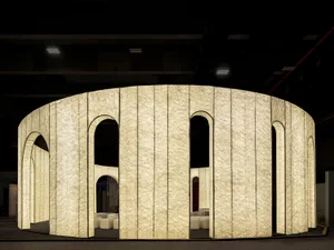 A minimalist architectural installation featuring textured fabric panels.
