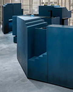 Minimalist interior design featuring a blue wooden structure.