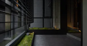 Industrial-style interior with concrete and metal elements, featuring a minimalist design.